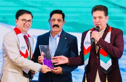 Bakhtiar Khattak on stage at an international event