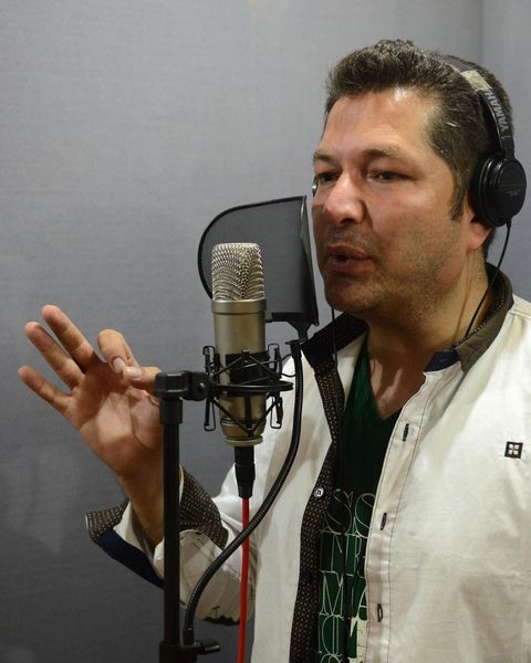 Bakhtiar Khattak tracking vocals in the studio