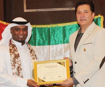 Bakhtiar Khattak receiving a certificate of membership in the United Arab Emirates